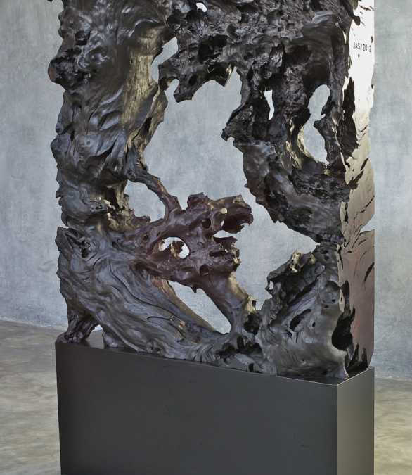 24 Mahogany root sculpture on black iron stand